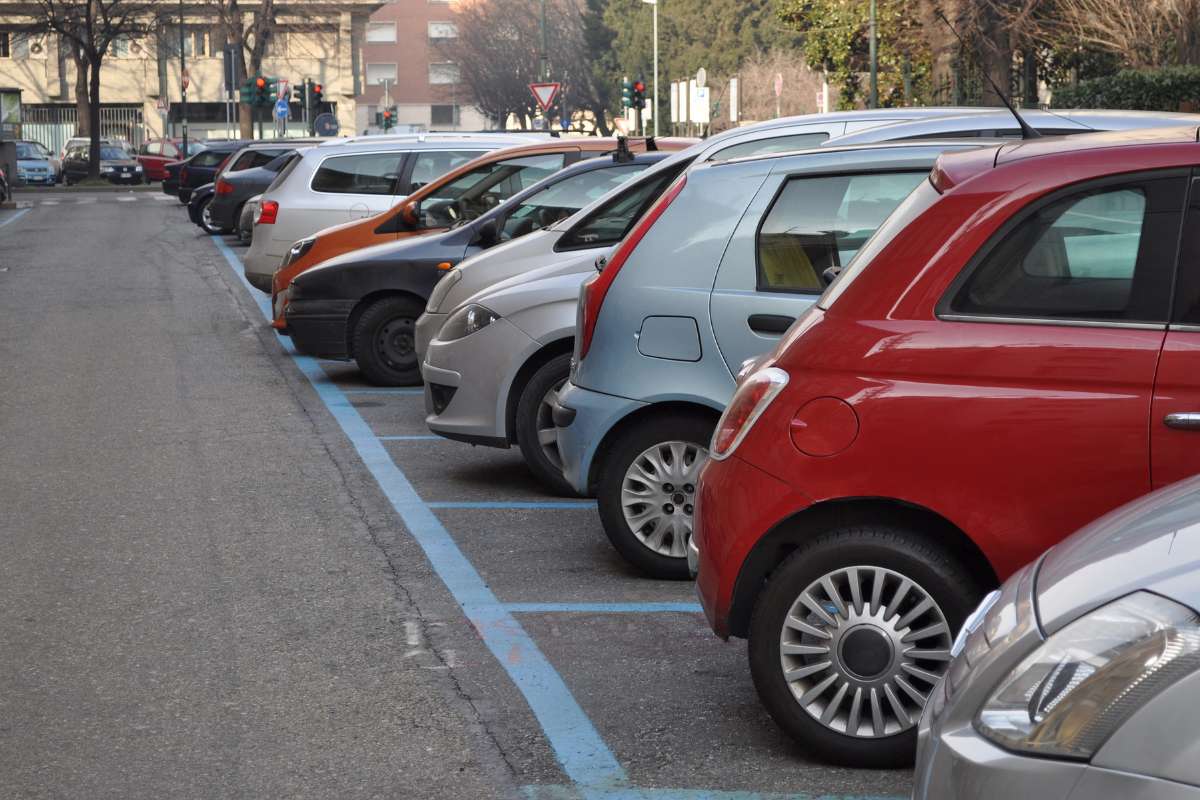 Herringbone parking spaces occupied by vehicles